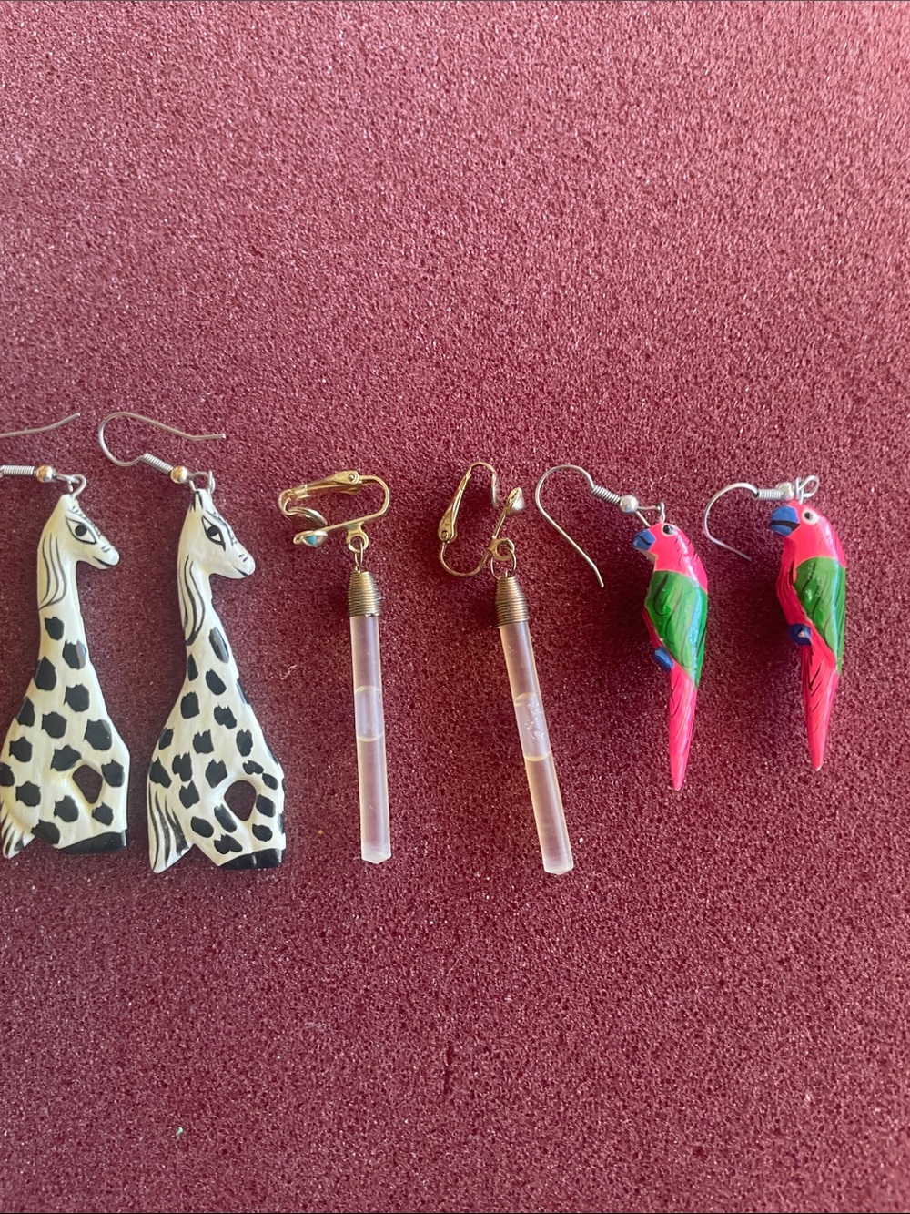Three pairs of fun earrings.
Giraffe, Tube style, and parrot